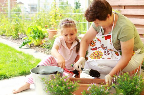 Front view of a gardener inspecting a residential garden bed